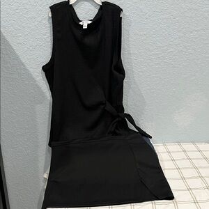 Elegant Black Sleeveless Top & Mini Skirt Set.